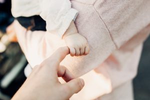 Baby holding a finger